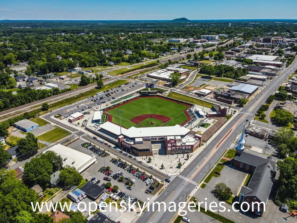 Aerial view of a sports field within a larger campus-like property.